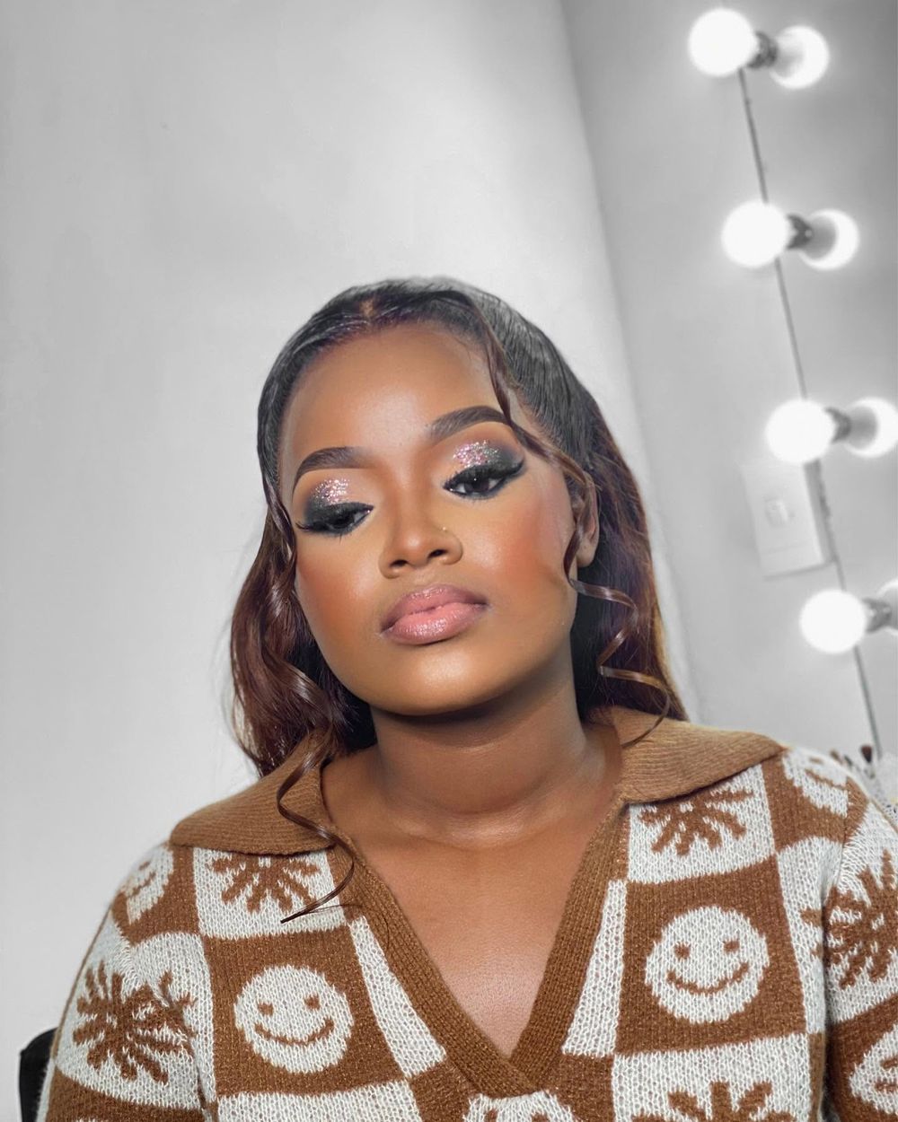 Soft glam makeup with styled hair