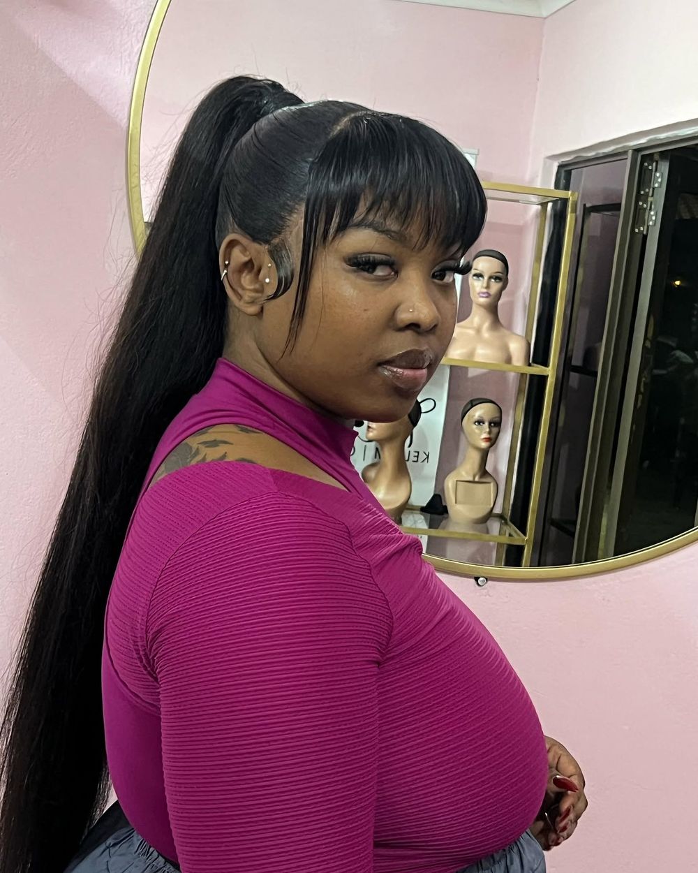High ponytail with bangs